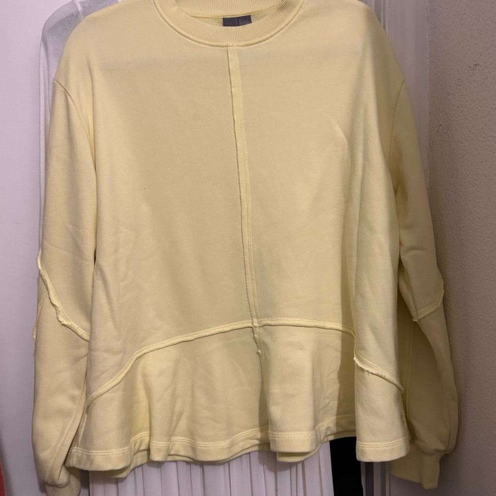 Yellow Sweaty Betty sweatshirt with ruffled bottom. Medium.